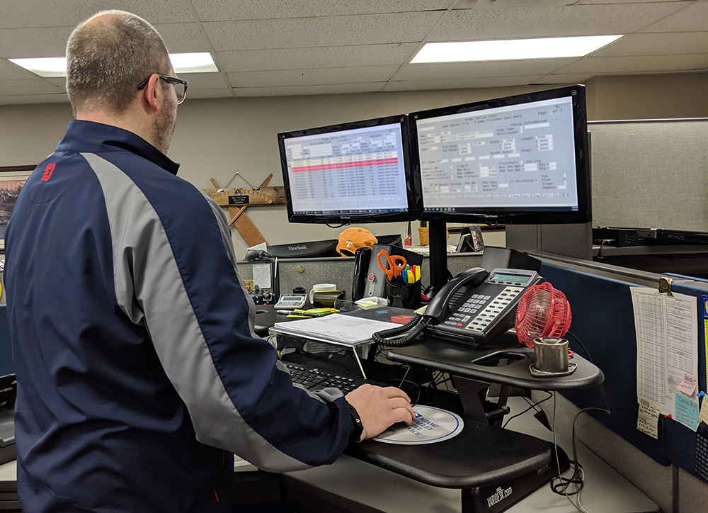 Employee using a standing desk